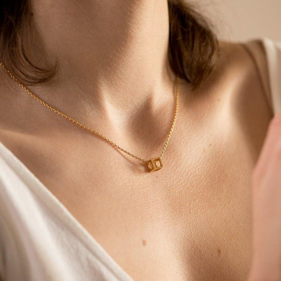 LÚDERE gold square box pendant necklace on a rolo chain