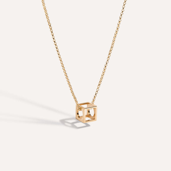 LÚDERE gold square box pendant necklace on a rolo chain